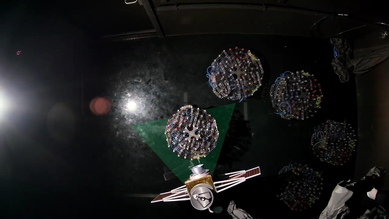 Top-down sequence of an air-bearing floating platform approaching its docking target during a successful SCoCaT hardware run